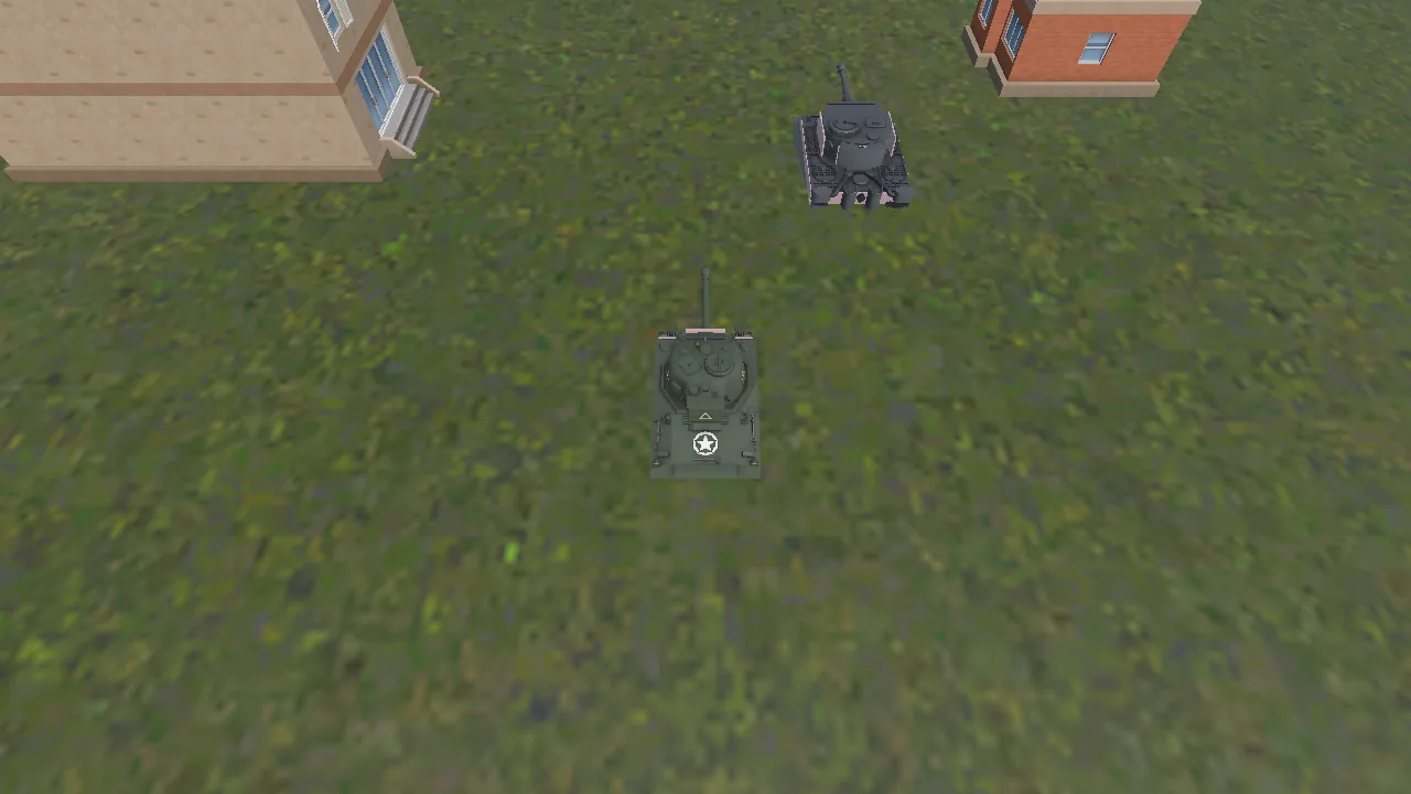 Two small tanks on grass, seen from high above